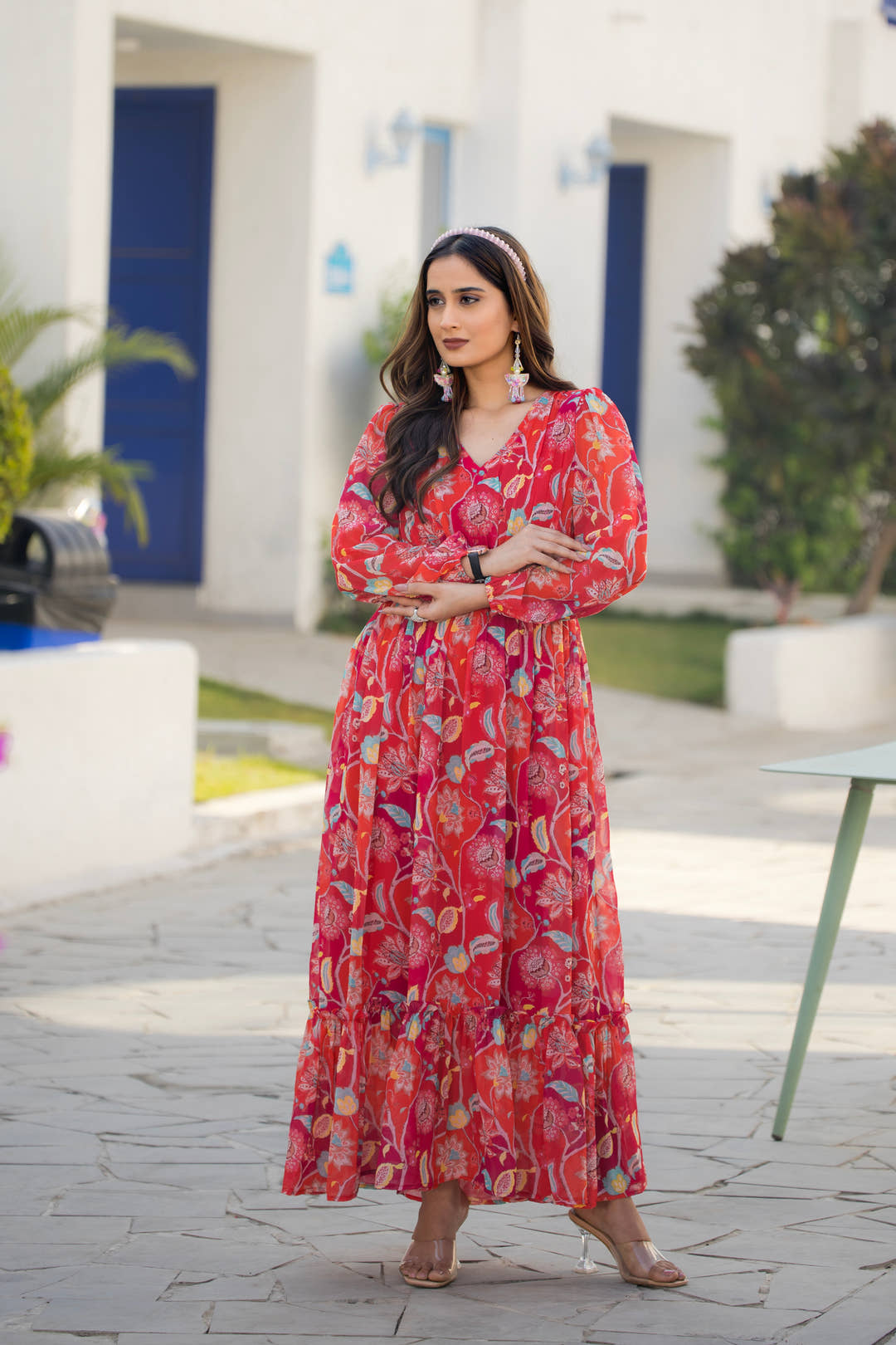 Full-length view of red floral maxi dress styled with silver accessories