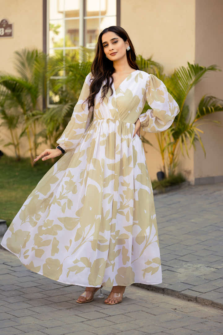 Full-length view of petal green & cream floral maxi dress styled with silver accessories
