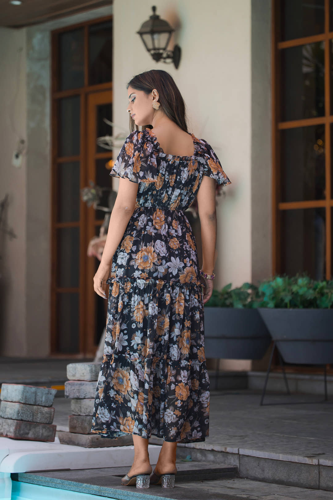 Back view of black midi dress with U-neckline and half sleeves