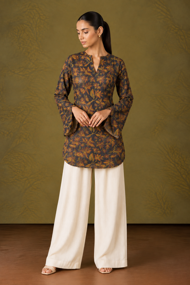 Model wearing a dark cocoa short kurti with muted botanical print and flared sleeves